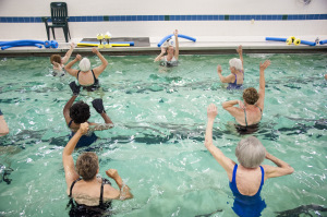 Seniors exercising in water